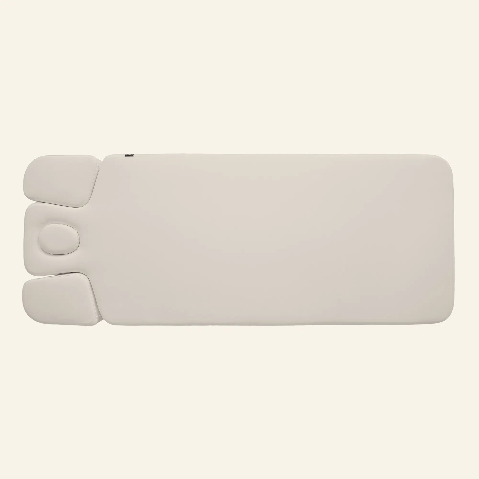Beige massagetafel met hoofd- en armsteun